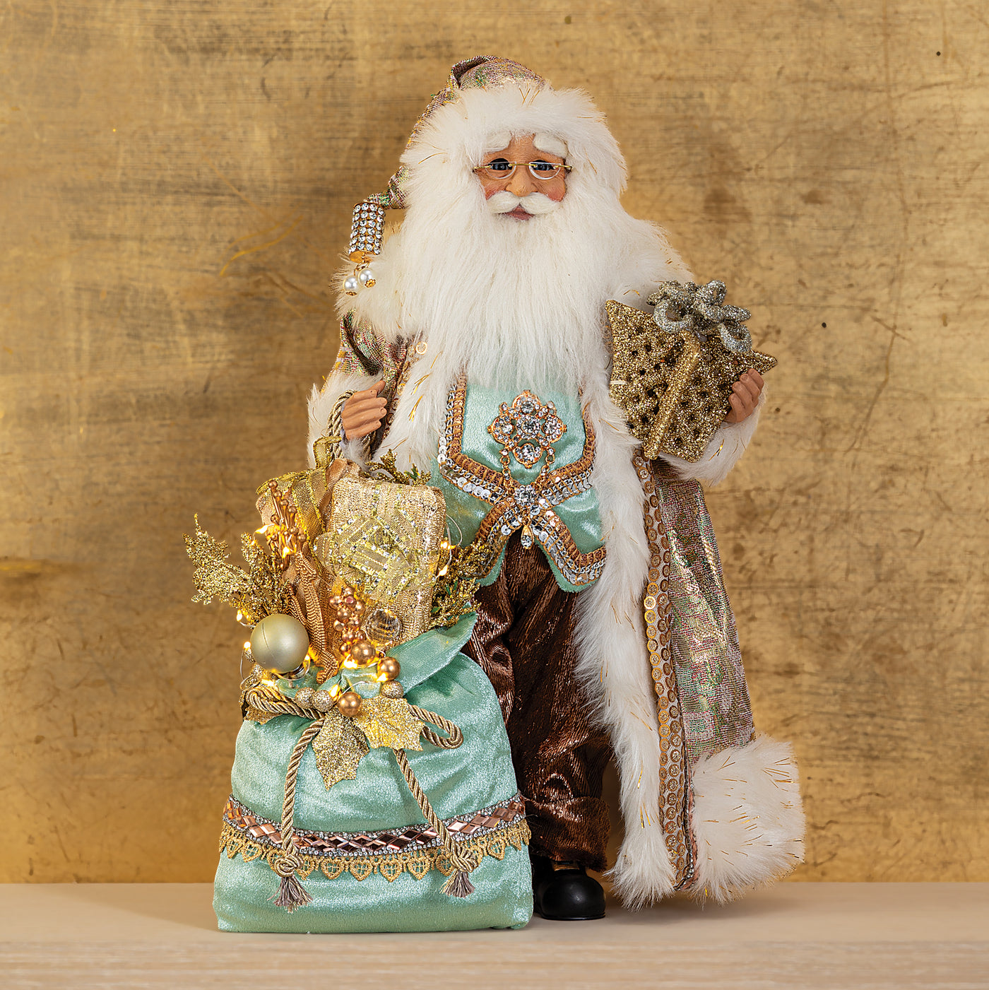 Golden Santa with Glowing Gift Sculpture