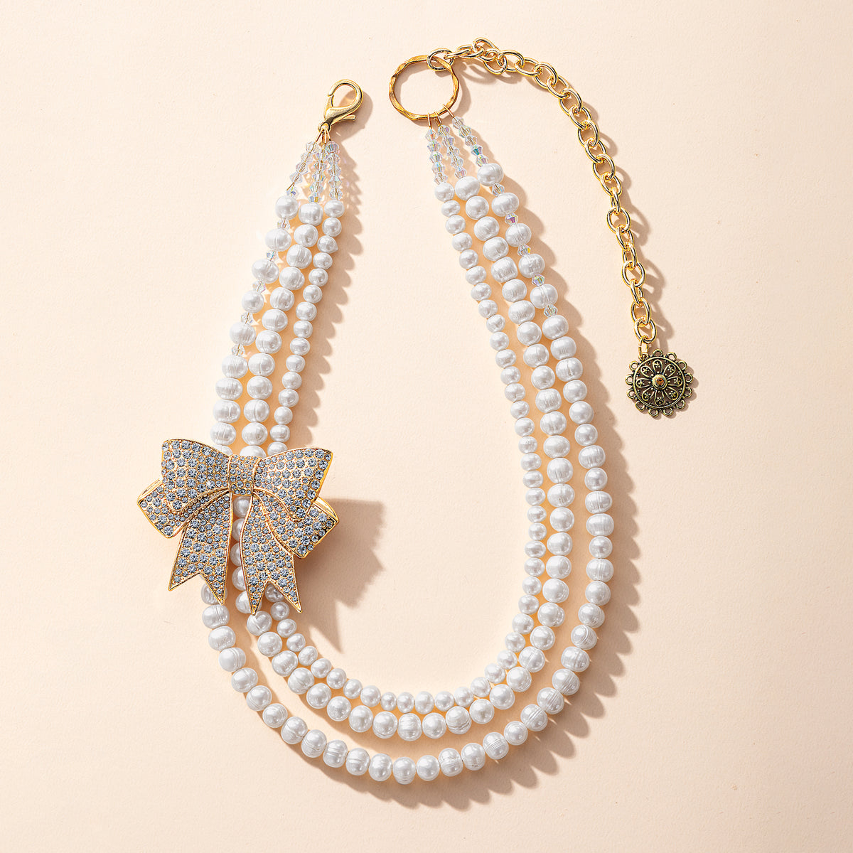 Tied to Perfection Triple Strand Pearl Necklace