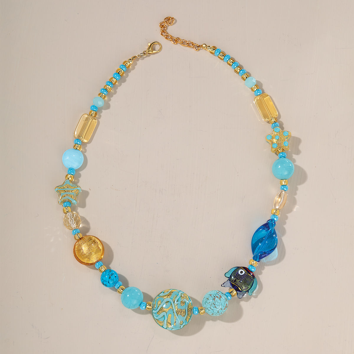 Turquoise Fishnet Murano Glass Turquoise & Gold Foil Infused Fish Necklace | Uno Alla Volta